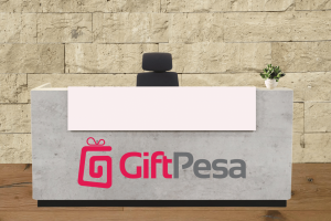 image showing a reception desk with the giftpesa logo on it.